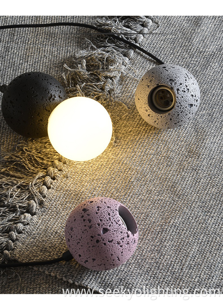 It features a unique design with a combination of stone and glass materials, creating a sleek and elegant look.